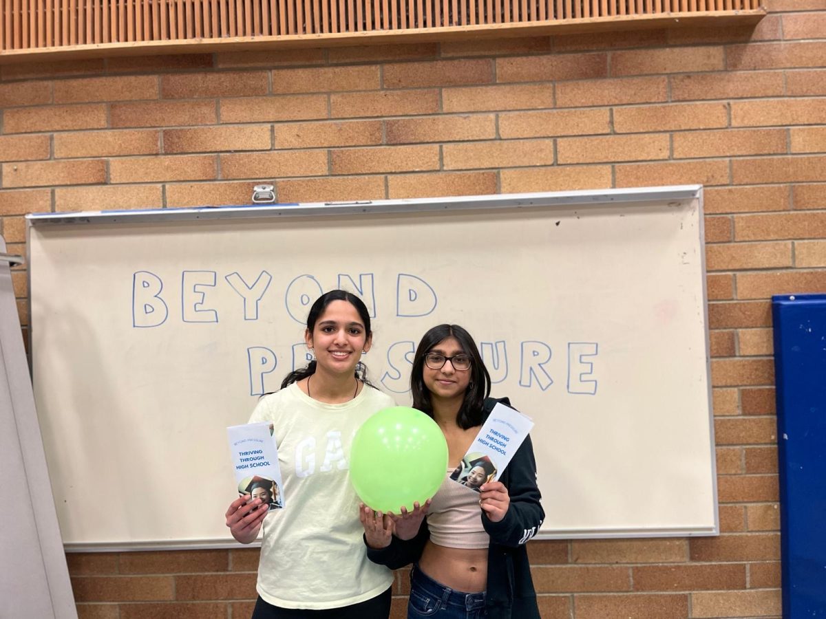 These are the founders of Beyond Pressure at an event where they distributed brochures with information about academic stress and talked to parents about handling their kids stress.