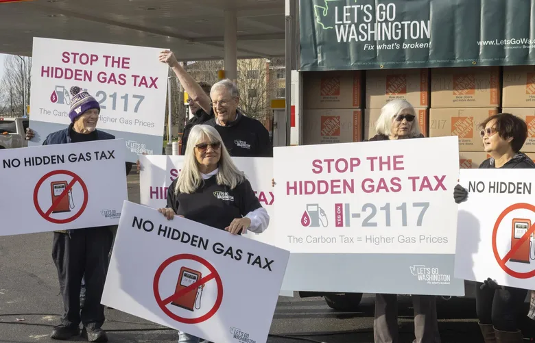 Backers of the initiative during a news event at Jackson's Shell Station in Kent.